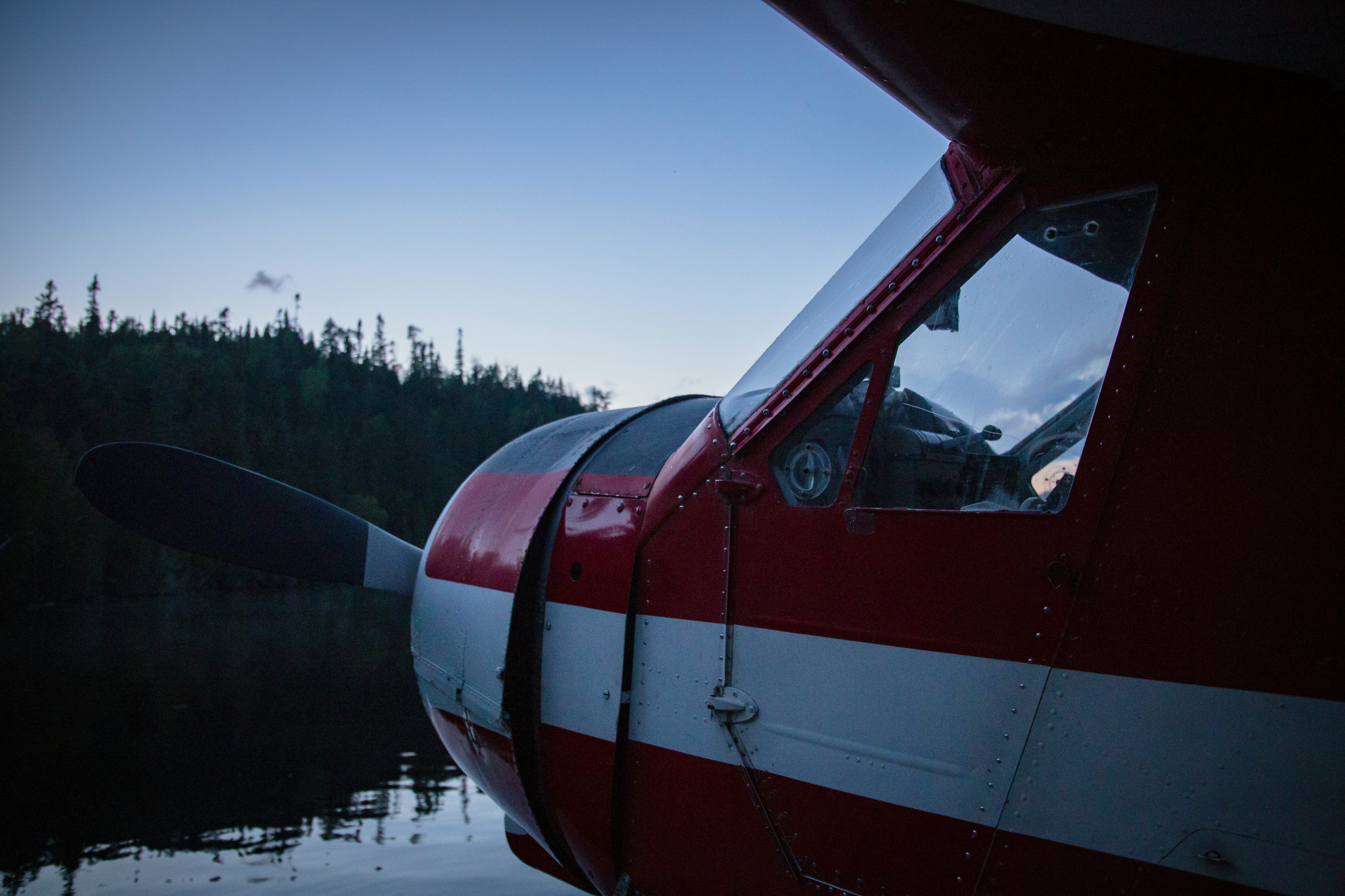 selective focus photo of red biplane